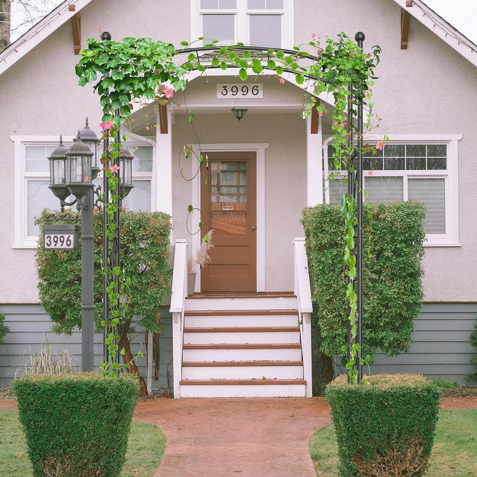 Metal garden arch trellis with decorative design, 7-foot wedding backdrop stand for garden or outdoor events.