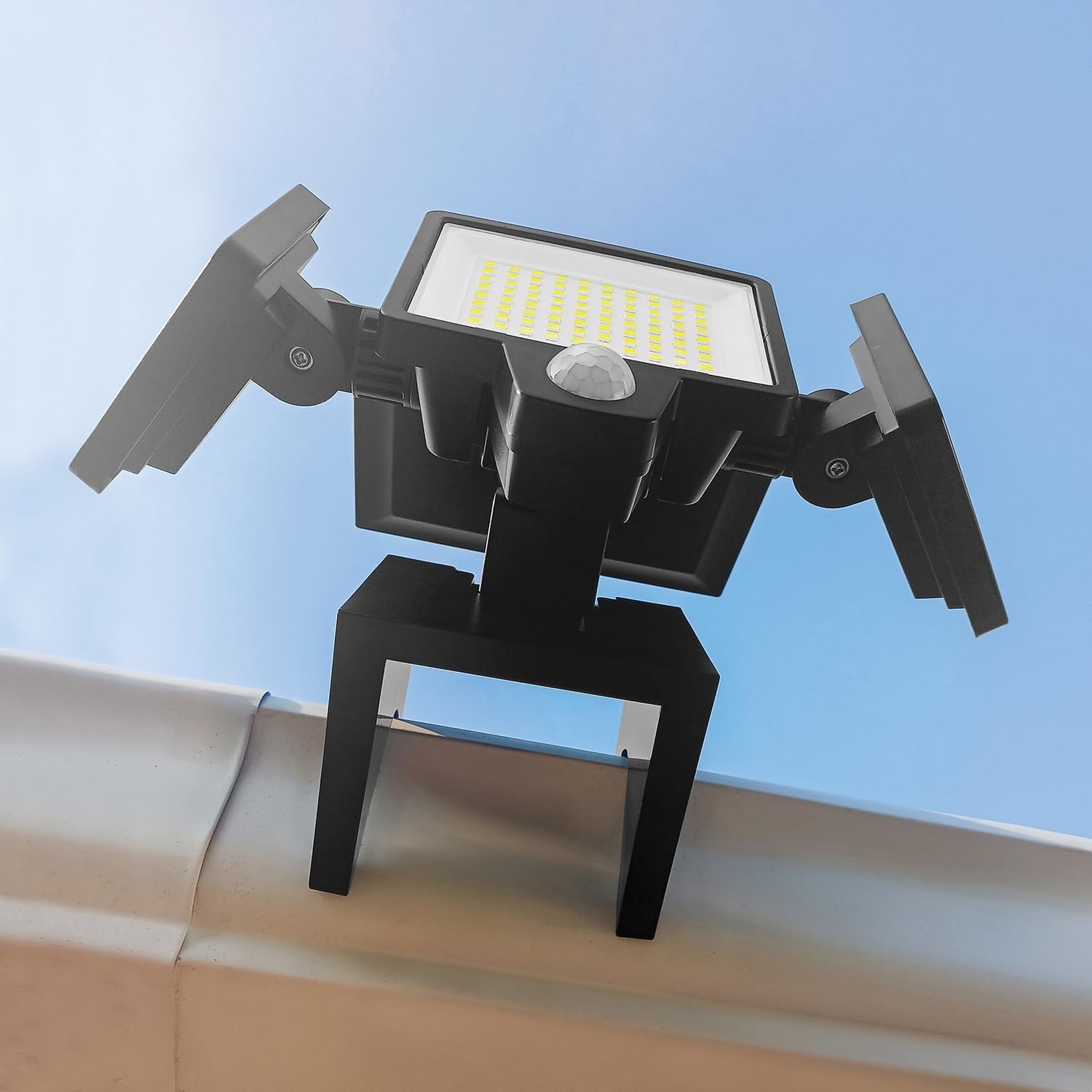 TOOLESS AMS1971 1000-Lumen Gutter-Mount Solar Security Light with triple-head design mounted on a gutter for outdoor security.