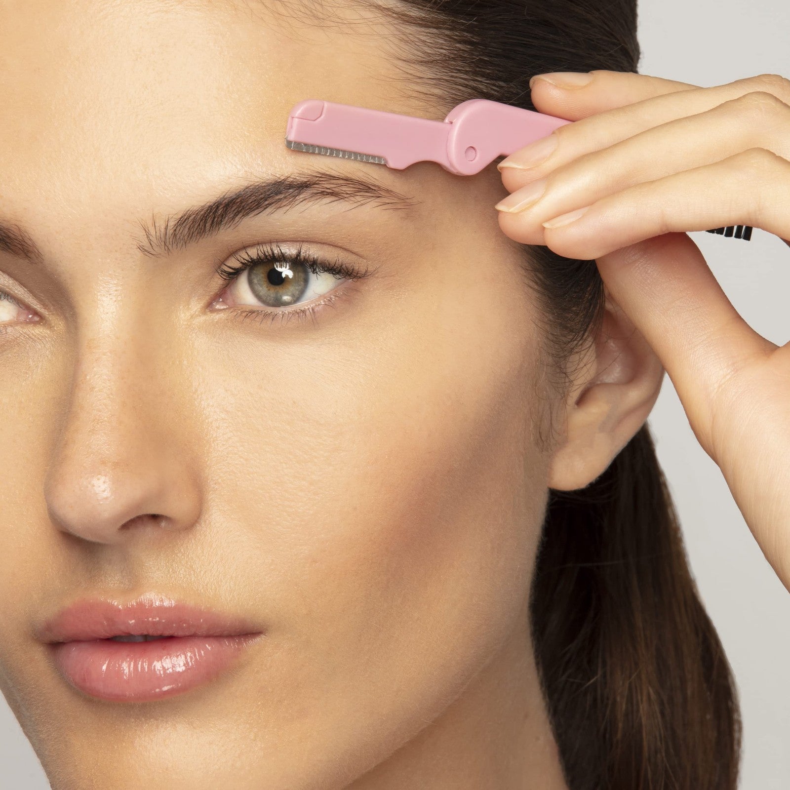 Tweezerman Tea Rose Brow Sculpting Set with tweezers, brow brush, and scissors for shaping and defining eyebrows.