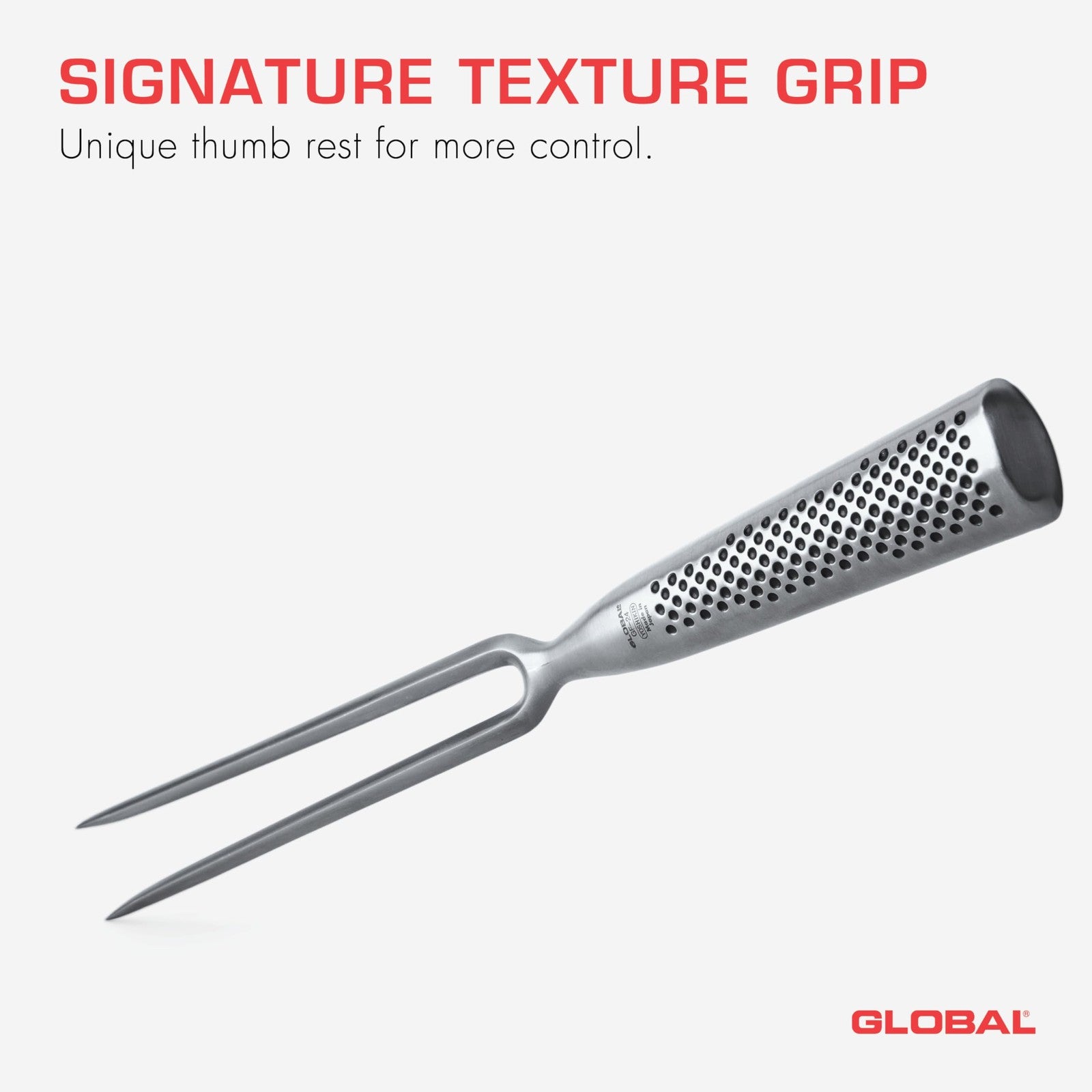 Global 7-inch forged stainless steel carving fork with straight tines, lightweight and durable for precise meat carving.