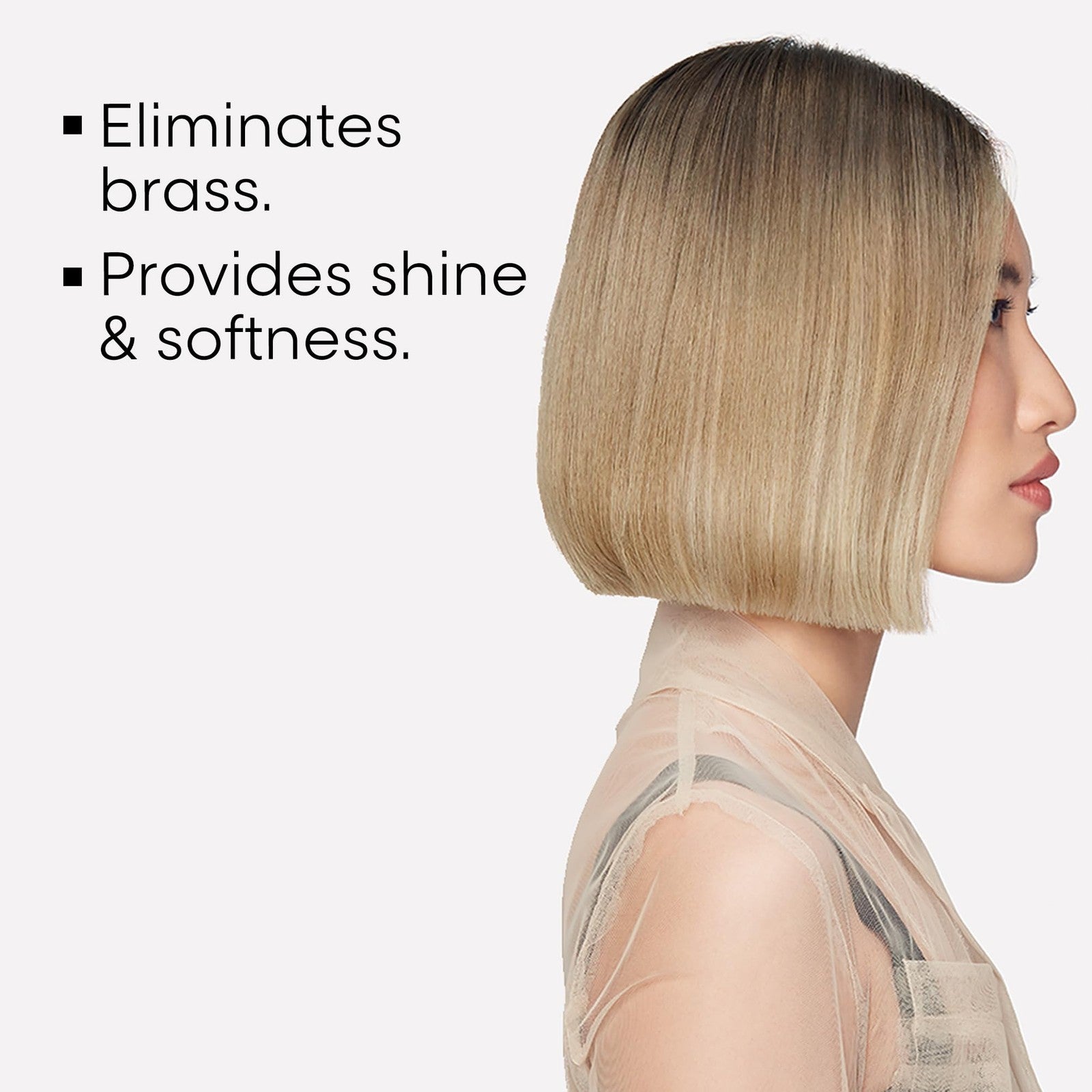 L'Oréal Professionnel Paris Color Depositing Purple Shampoo bottle with purple liquid inside, designed to neutralize yellow tones in hair.