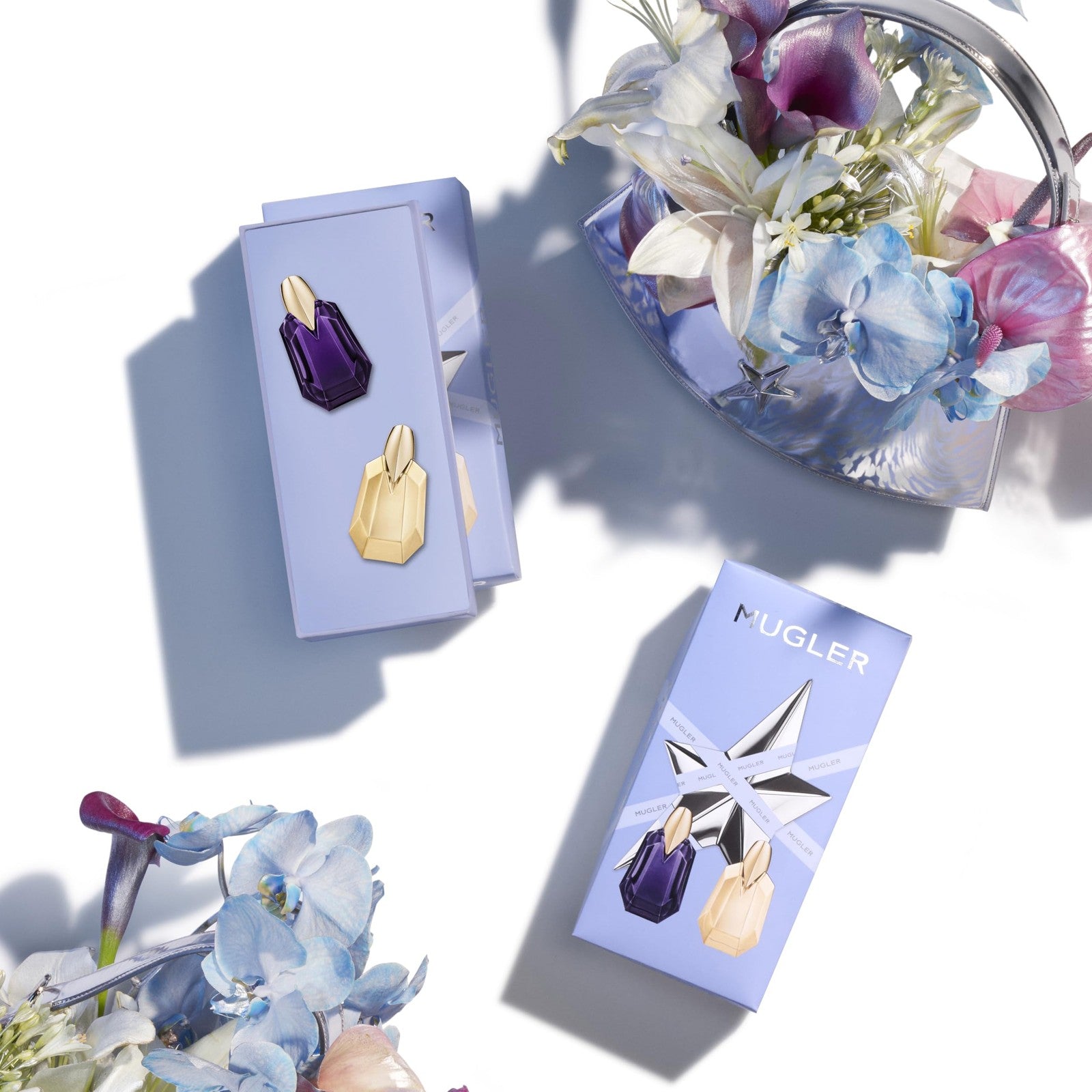 Mugler Alien and Alien Goddess women's fragrance mini gift set with floral and woody scents, displayed with bottles and packaging
