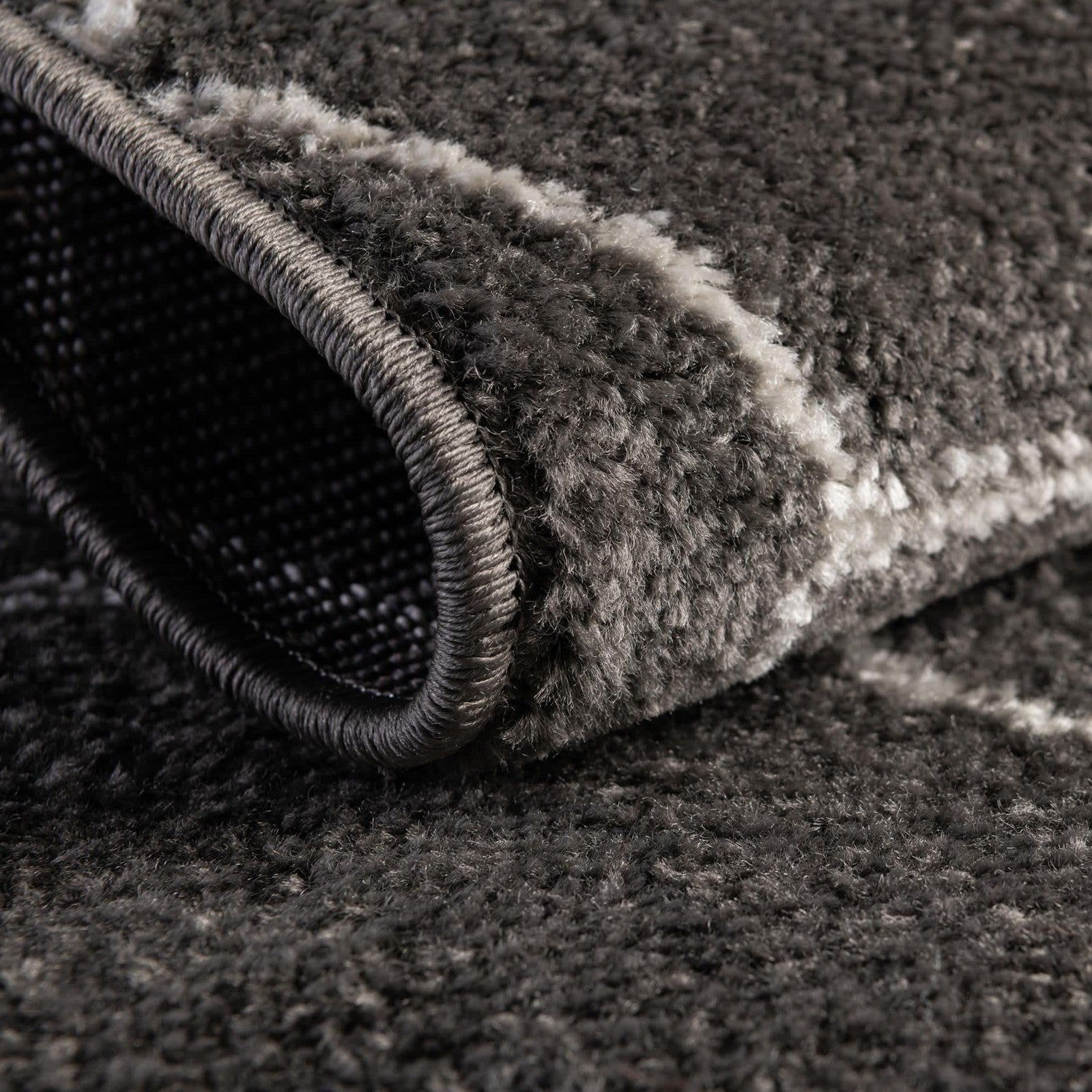 Dark gray geometric area rug from the Unique Loom Trellis Frieze Collection featuring a round shape and modern design.