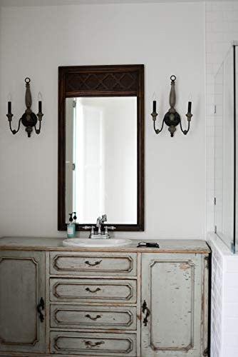 Kingston Brass Heritage 4-inch centerset lavatory faucet with metal lever handles and polished finish.