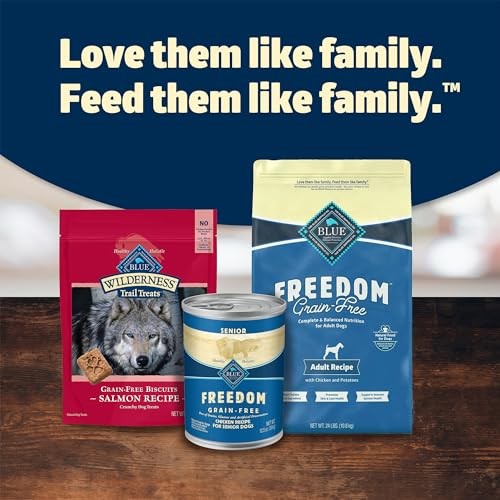 Cans of Blue Buffalo Freedom grain-free senior wet dog food with blue and white packaging, featuring images of dogs and natural ingredients.