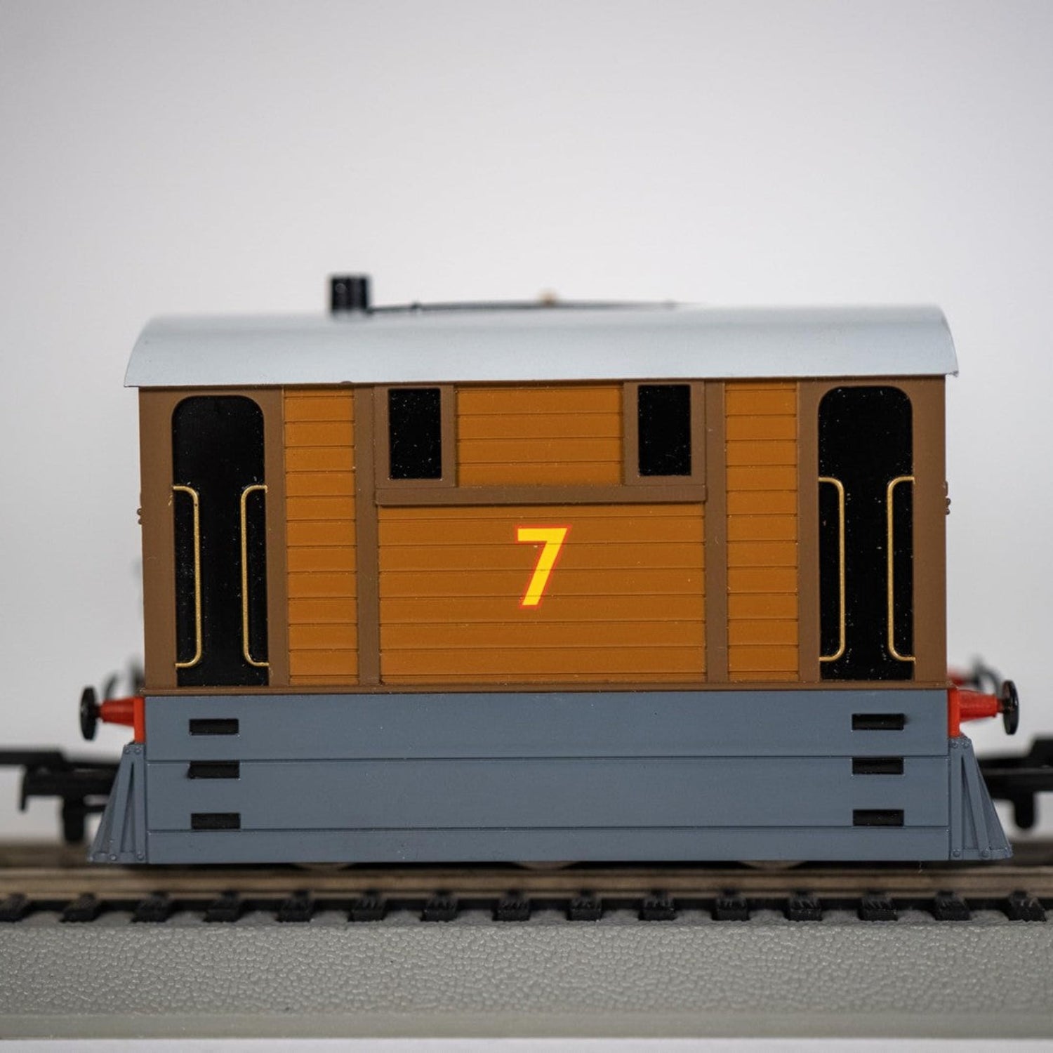 Bachmann Trains Thomas and Friends Toby the Tram Engine with moving eyes, black locomotive model on a track.