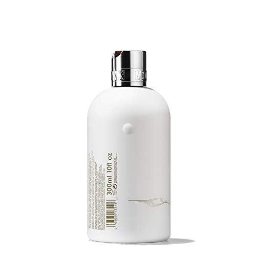 Molton Brown Milk Musk body wash in a 10 fl. oz. bottle with a soft, creamy appearance and elegant packaging.