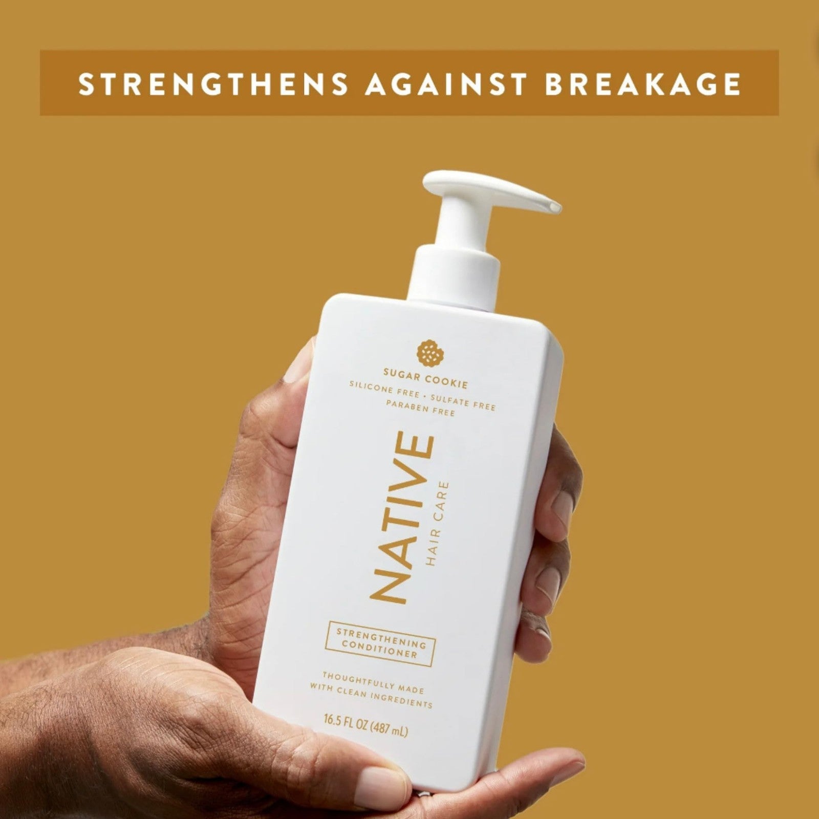 Native limited edition Sugar Cookie shampoo and conditioner bottles with white and gold packaging, displayed together.