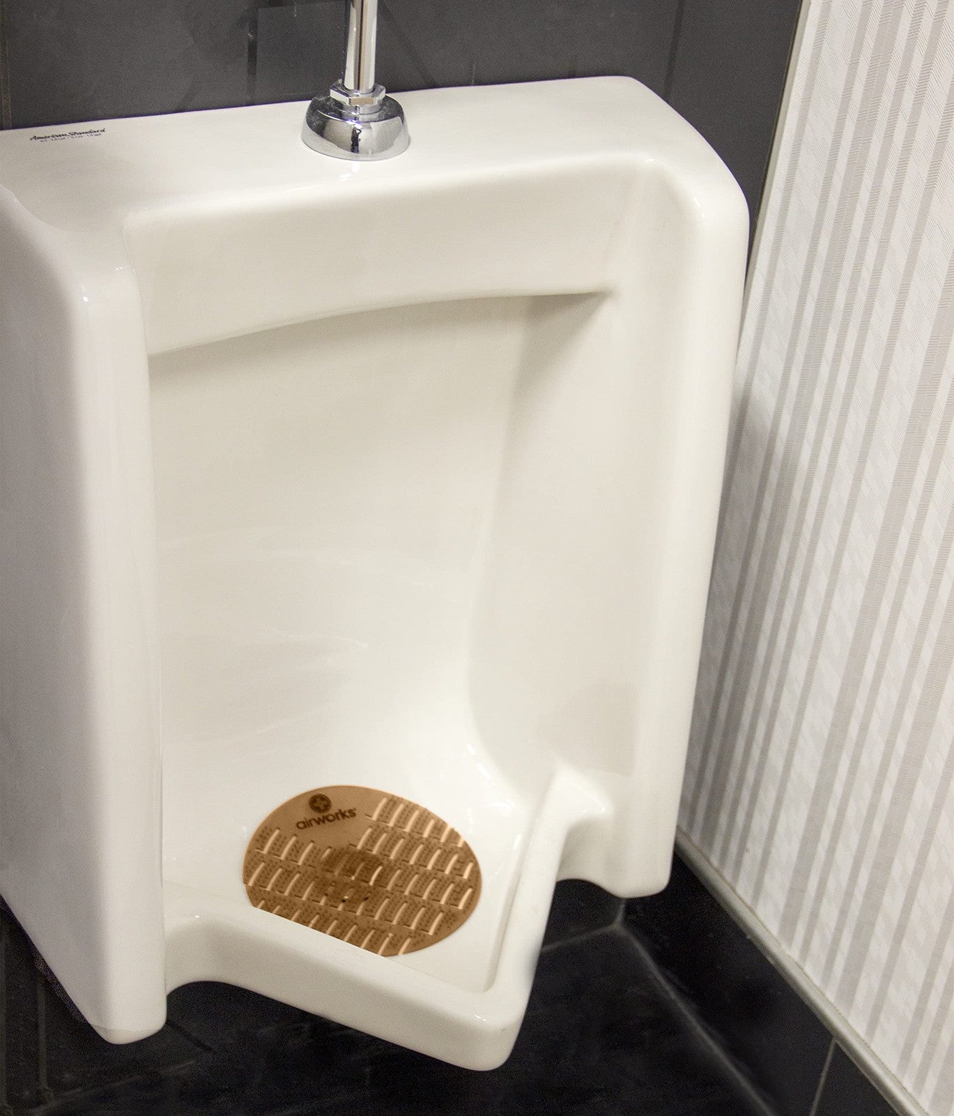 Light brown cinnamon urinal screens by Hospeco, set of 10, designed for freshening and odor control in bathrooms.