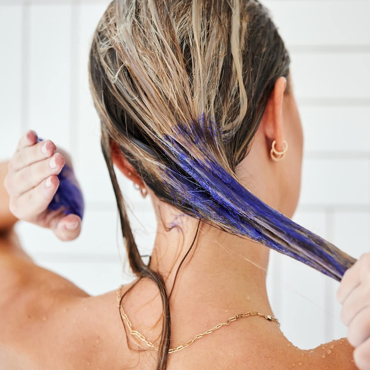 UNITE Hair Blonda Fix Ultra-Violet Repair Treatment bottle with purple cap, designed to tone and strengthen blonde hair.