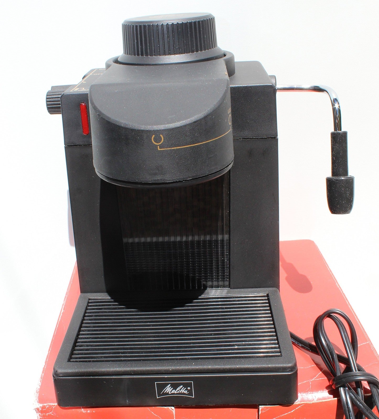 Melitta MEX1B espresso and cappuccino machine with stainless steel finish and built-in milk frother.