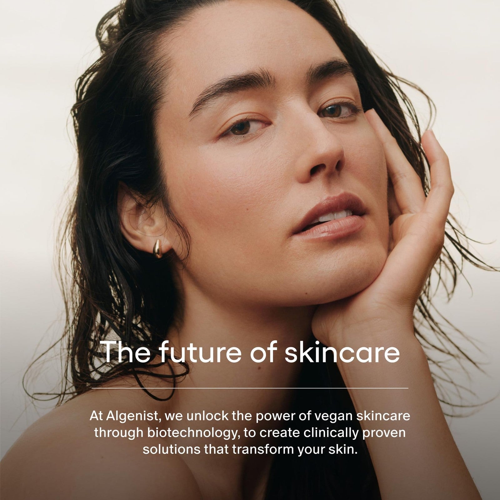 Algenist Genius Liquid Skin Resurfacing Face Toner with 2% BHA, showing the bottle and applicator for gentle exfoliation.