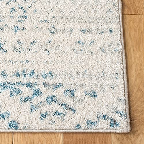 Safavieh Tulum collection 6x9 ivory and turquoise Moroccan boho tribal area rug with tribal patterns and vibrant colors.