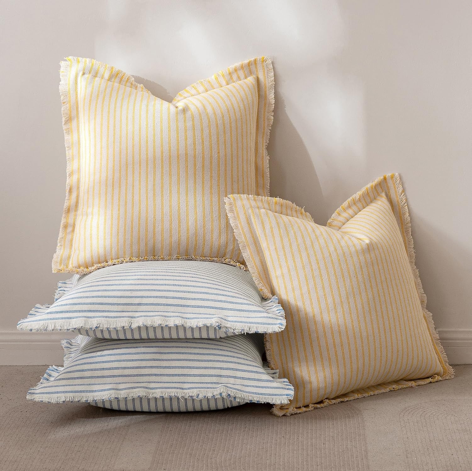 Light blue MIULEE pillow covers with 22x22 inch striped farmhouse design for sofa or couch decor.