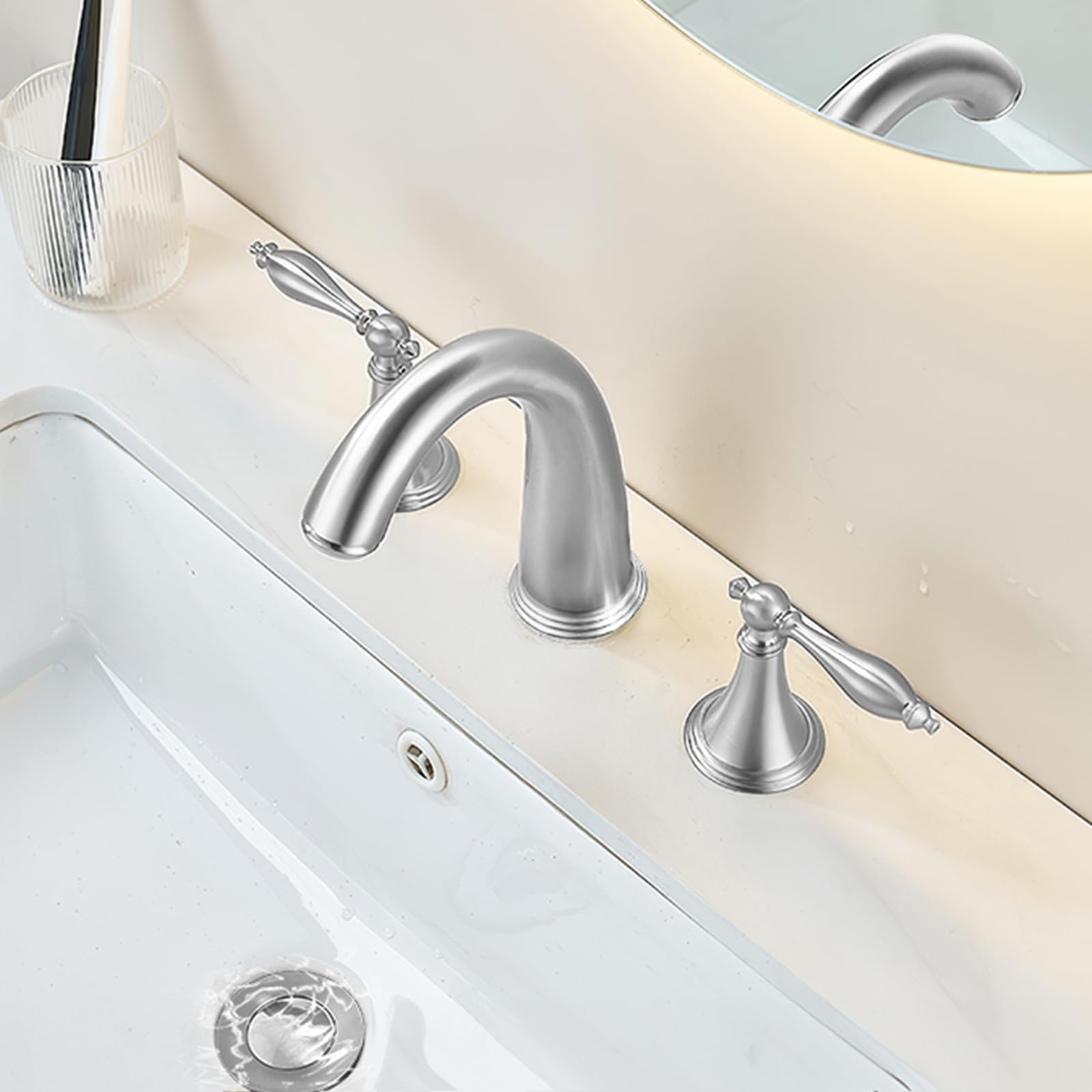 SaniteModar brushed brass bathroom sink faucet with three-hole wide design, modern style and durable finish.
