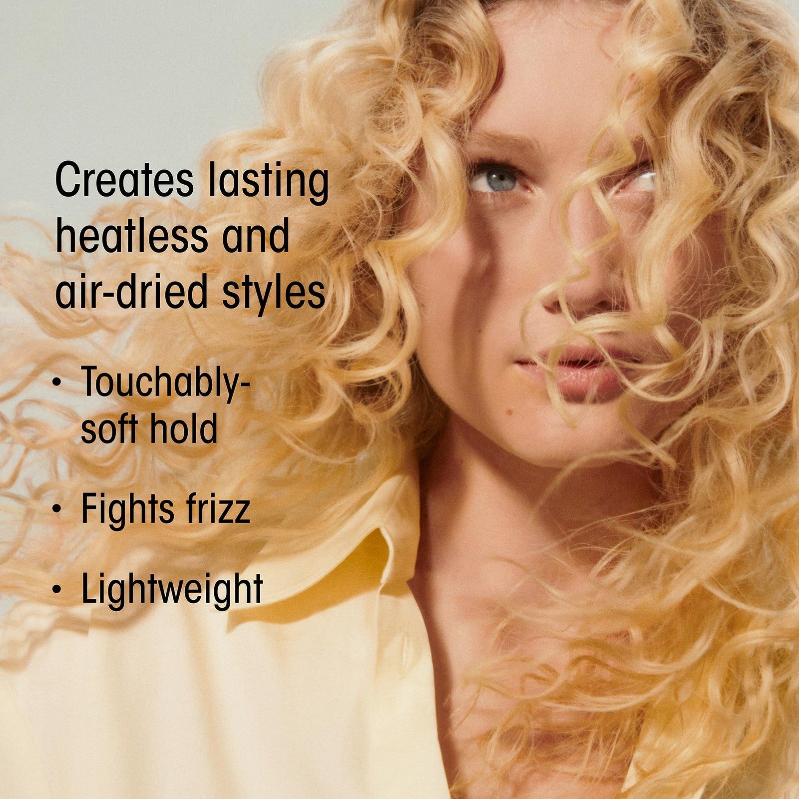 ORIBE Hair Alchemy Heatless Styling Balm in a jar, showcasing the luxurious hair care product for heat-free styling.