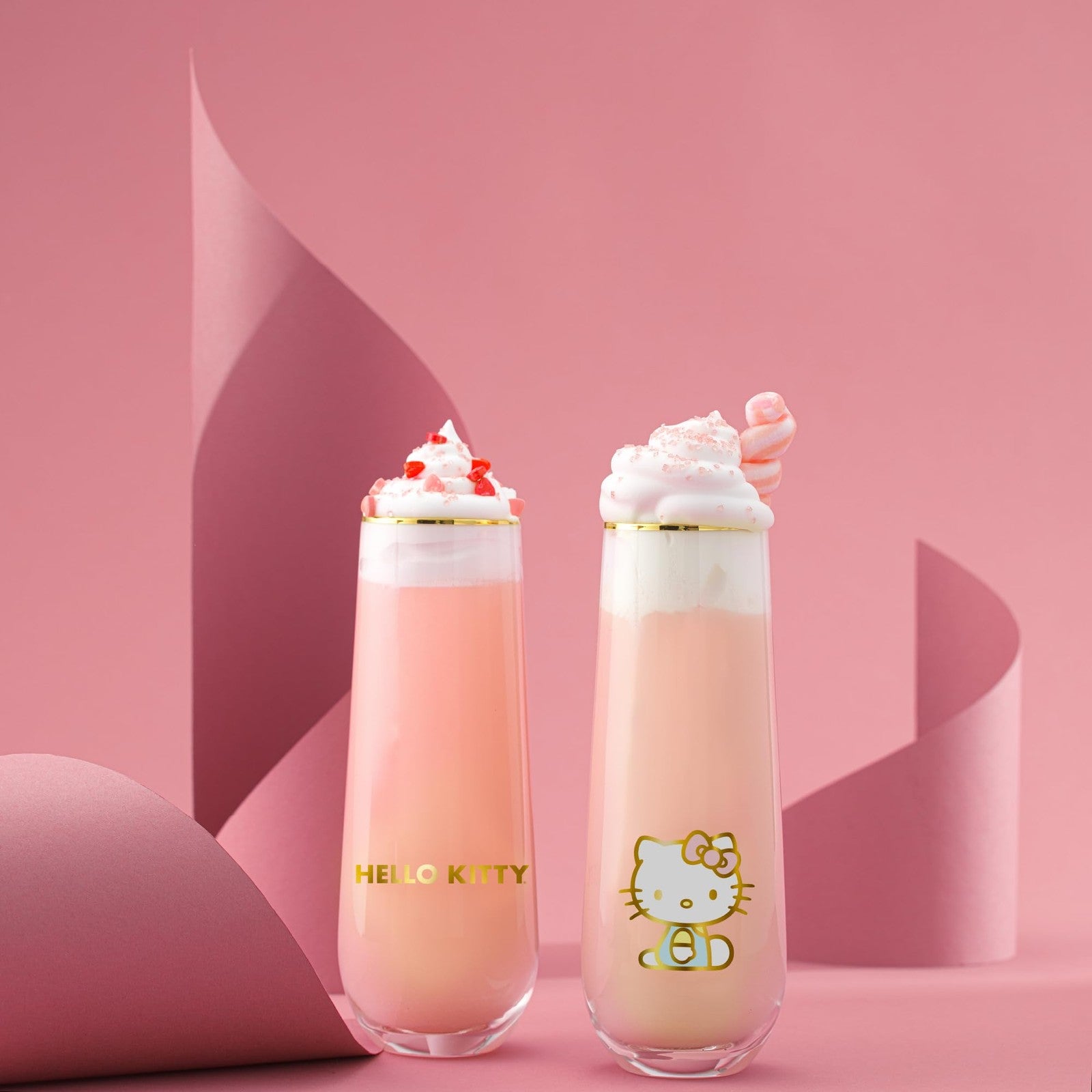 Set of four JoyJolt Hello Kitty Stay Gold stemless flutes with 9.4oz capacity, clear glass with gold accents, elegant drinking glasses.