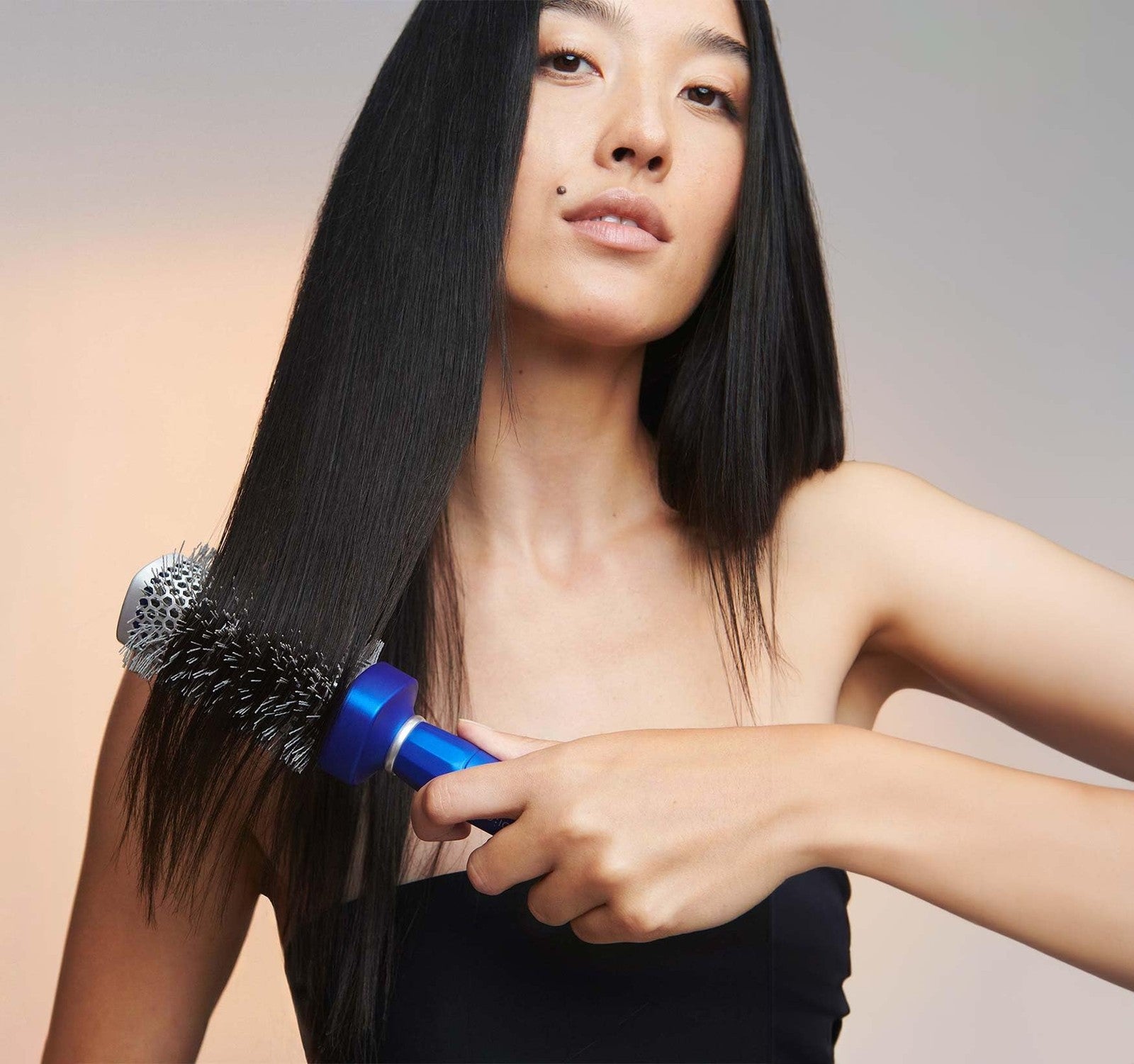 Large BIO IONIC Bluewave Nanoionic Conditioning Brush with blue and black handle and densely packed bristles for hair styling and conditioning.