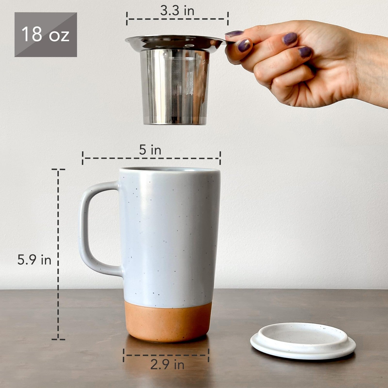 Large Mora Ceramics Hit Pause tea mug with built-in loose leaf infuser, featuring a modern ceramic design and comfortable handle.