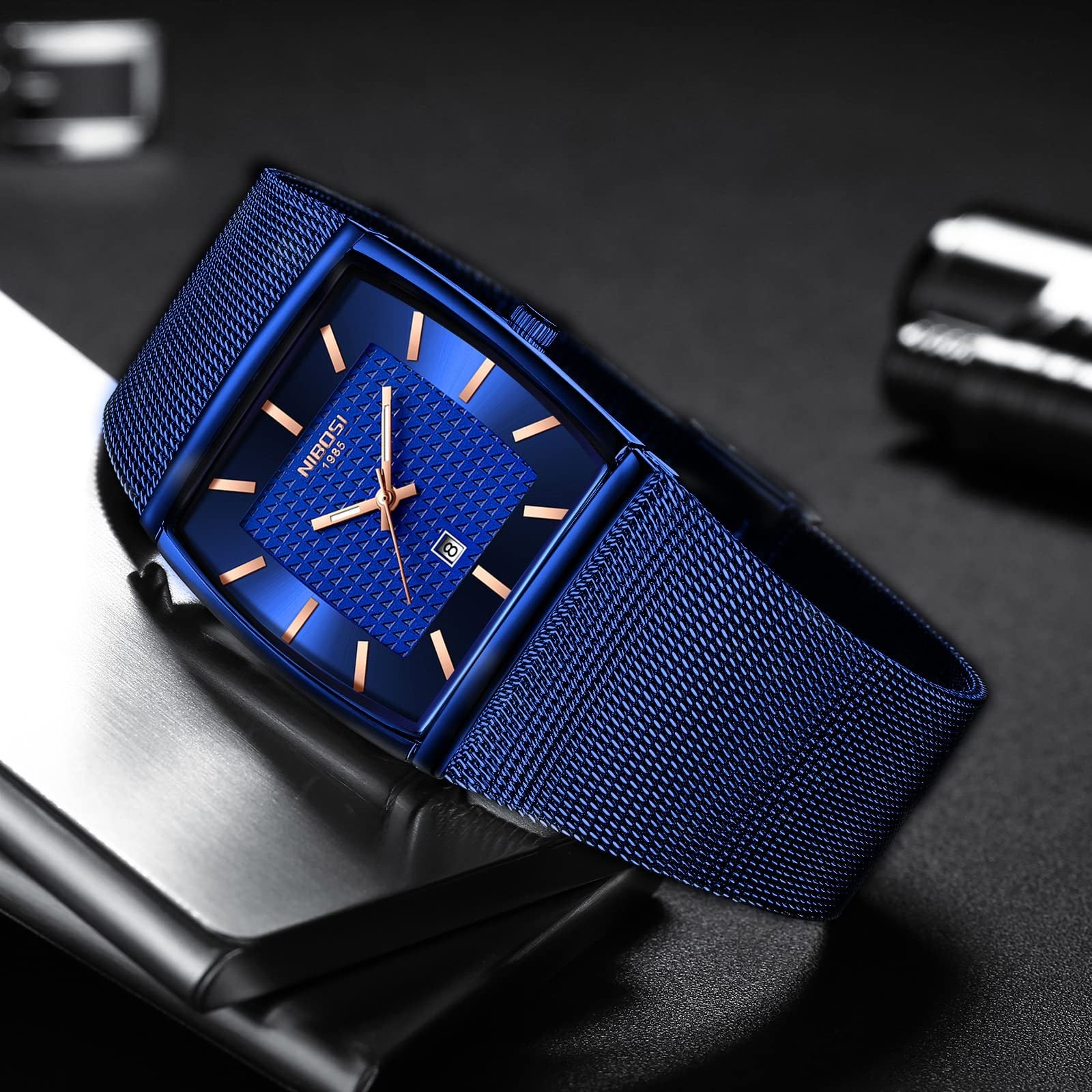NIBOSI men's square quartz watch with stainless steel band, blue dial, and 3ATM water resistance.