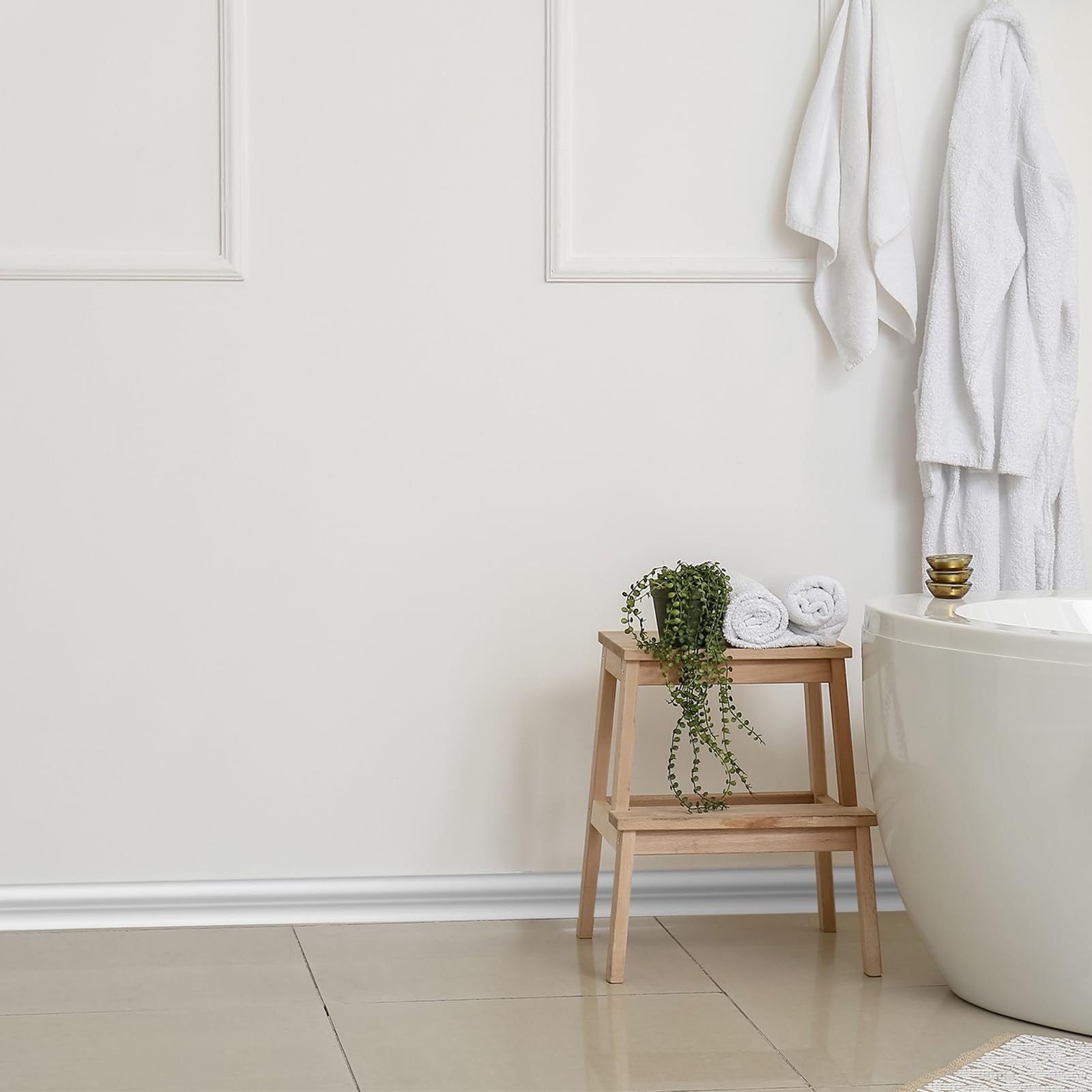 Innconee flexible peel and stick wall molding trim, 32.8ft, 1.25-inch wide, shown installed along a wall base for decorative finishing.
