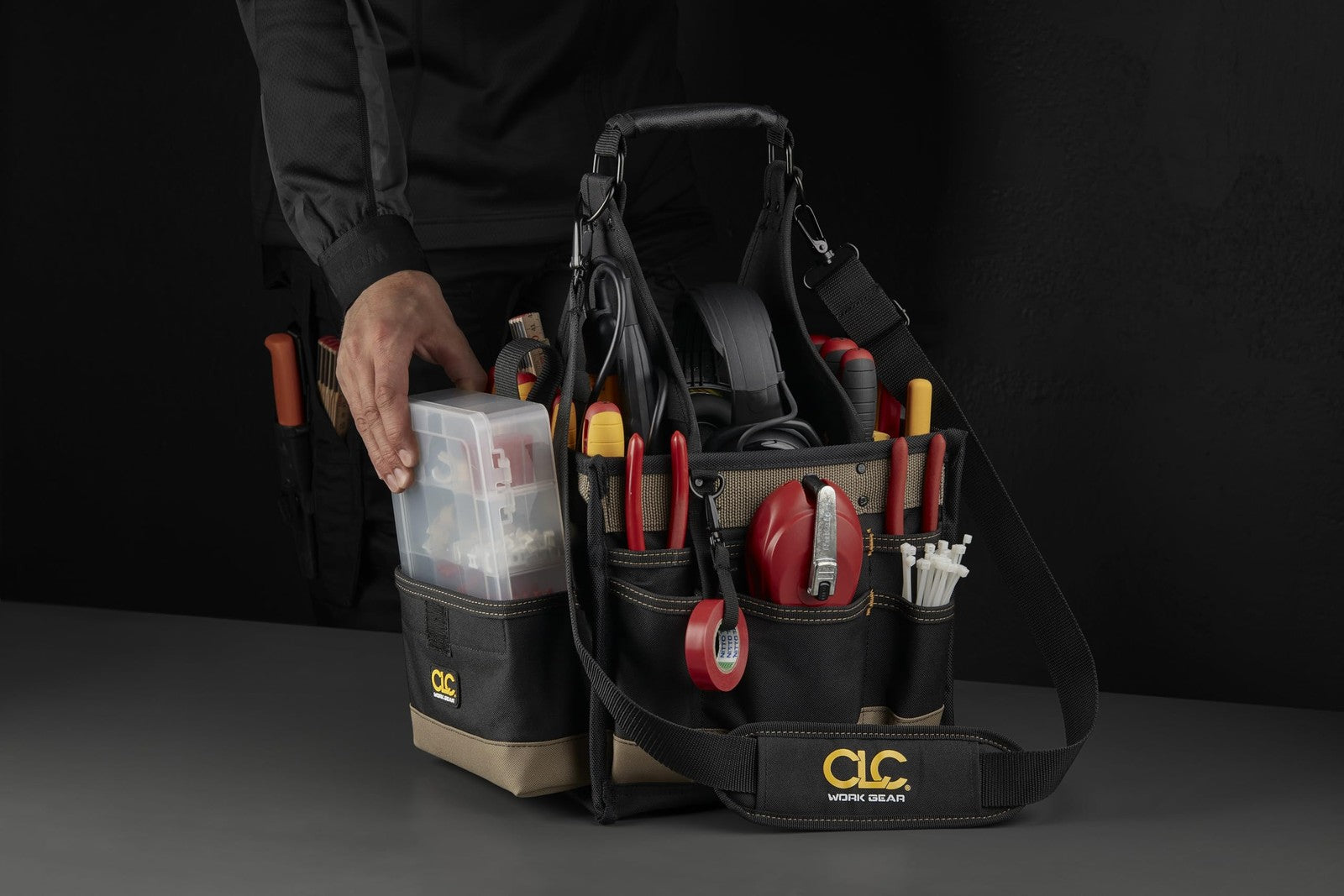 Custom Leathercraft 1526 25-pocket electrical maintenance tool carrier with leather and nylon construction, filled with hand tools.