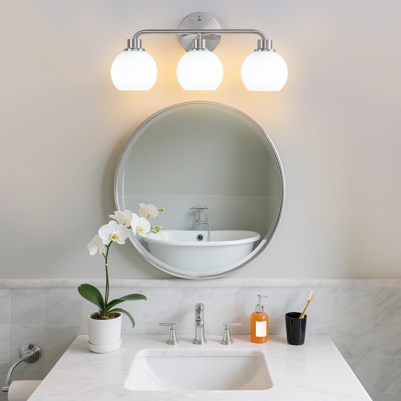 Watyo brushed nickel bathroom vanity light fixture with three wall sconces, ideal for modern bathroom decor.