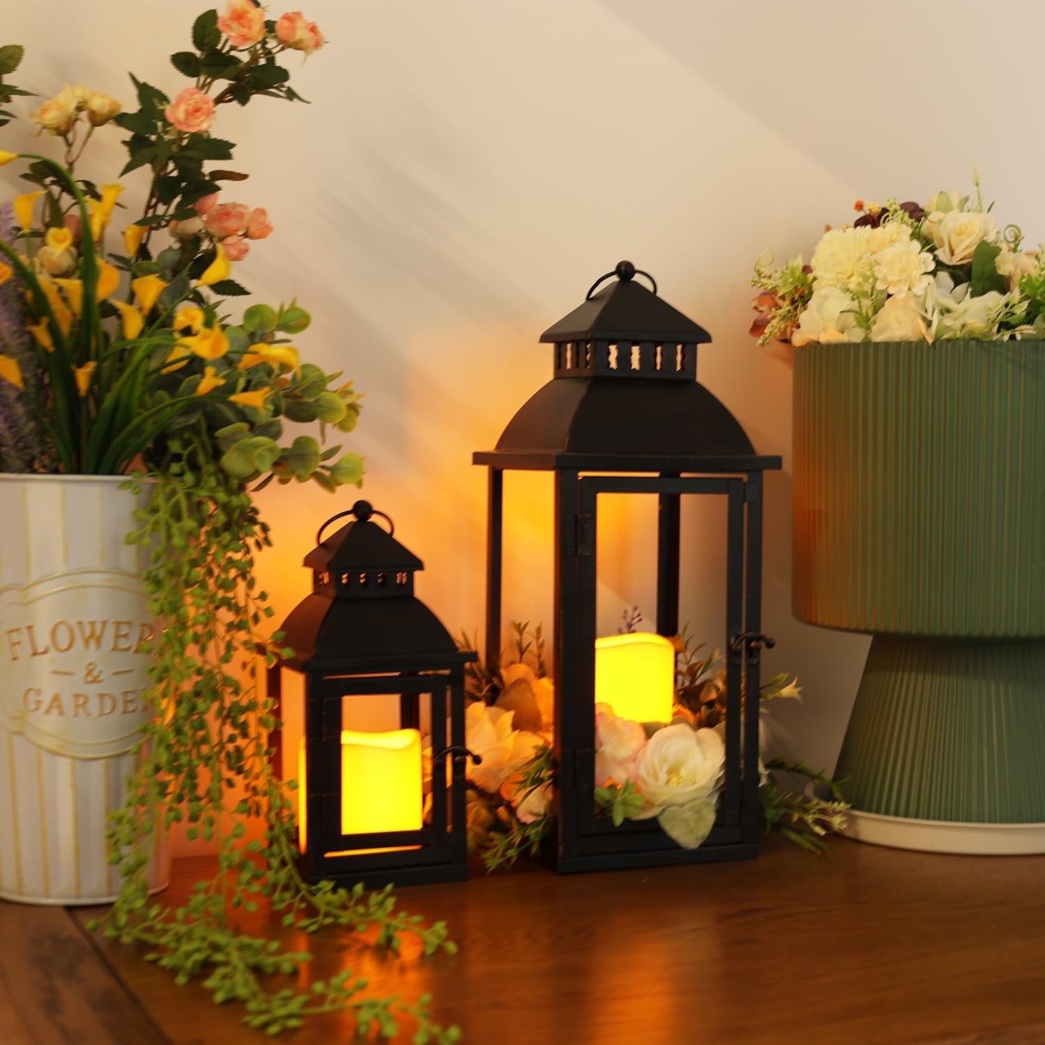 Pair of NEEDOMO LED lanterns with large bronze metal design, suitable for decorative outdoor and indoor lighting.