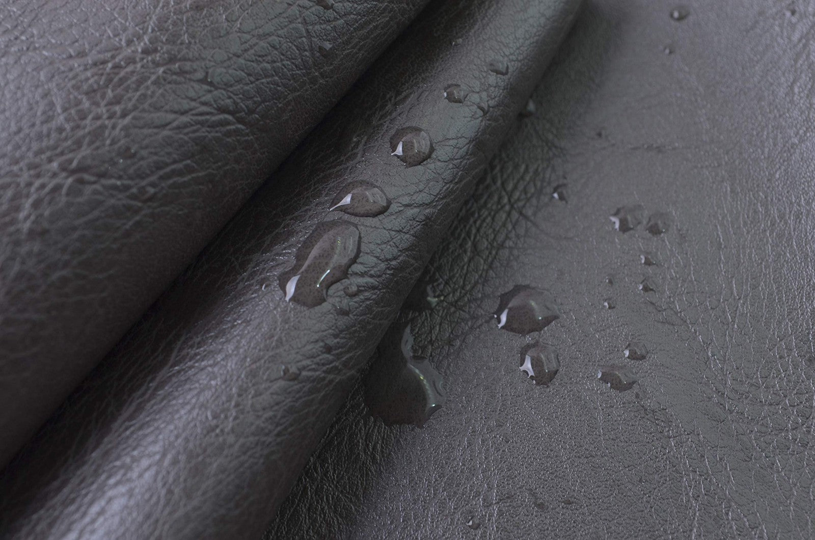 Close-up of Wento Thick Faux Leather Fabric showing soft skin grain texture in a neutral color.