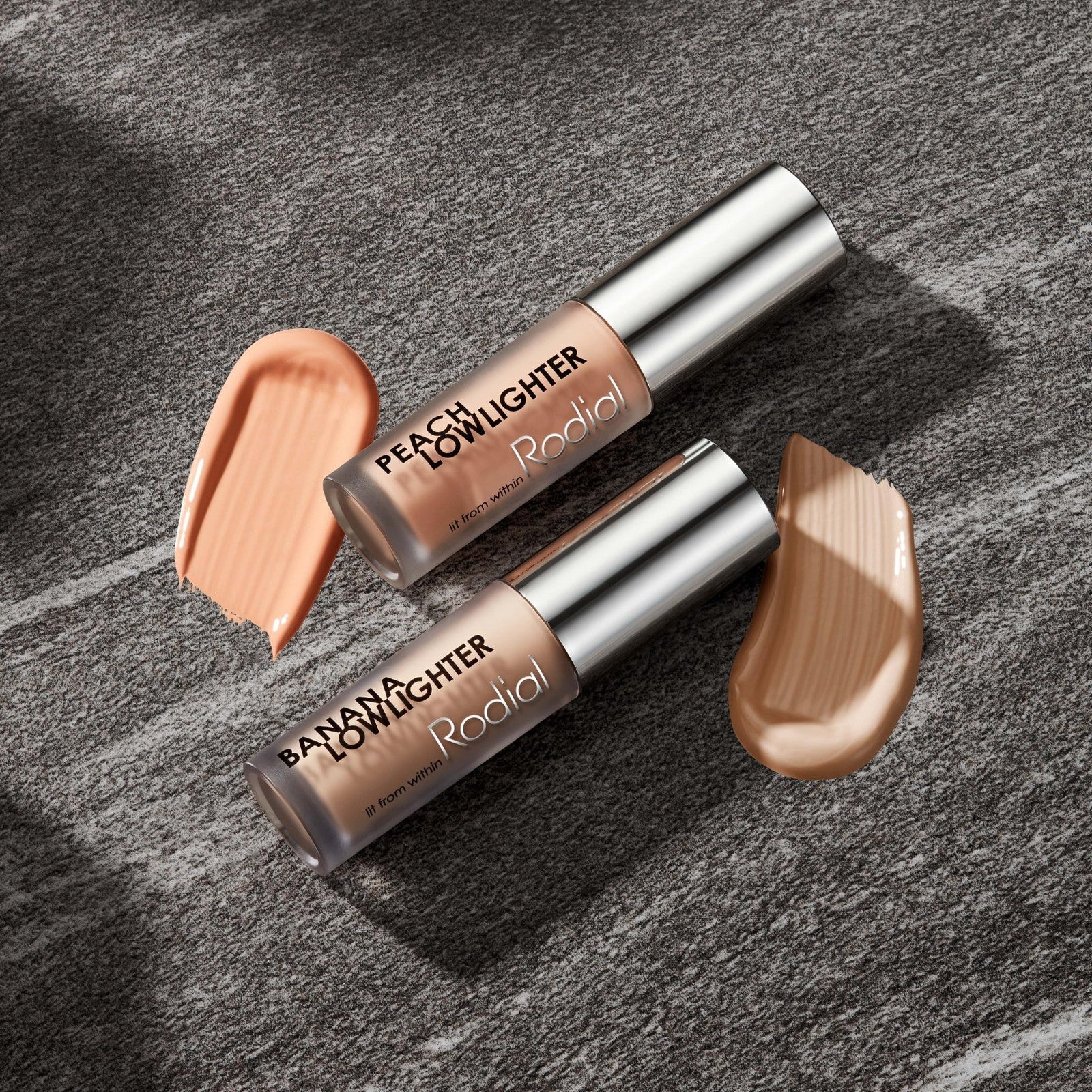 Rodial Peach Lowlighter under eye brightener in 0.1 fl oz, featuring a peach-colored hydrating formula for brightening skin.