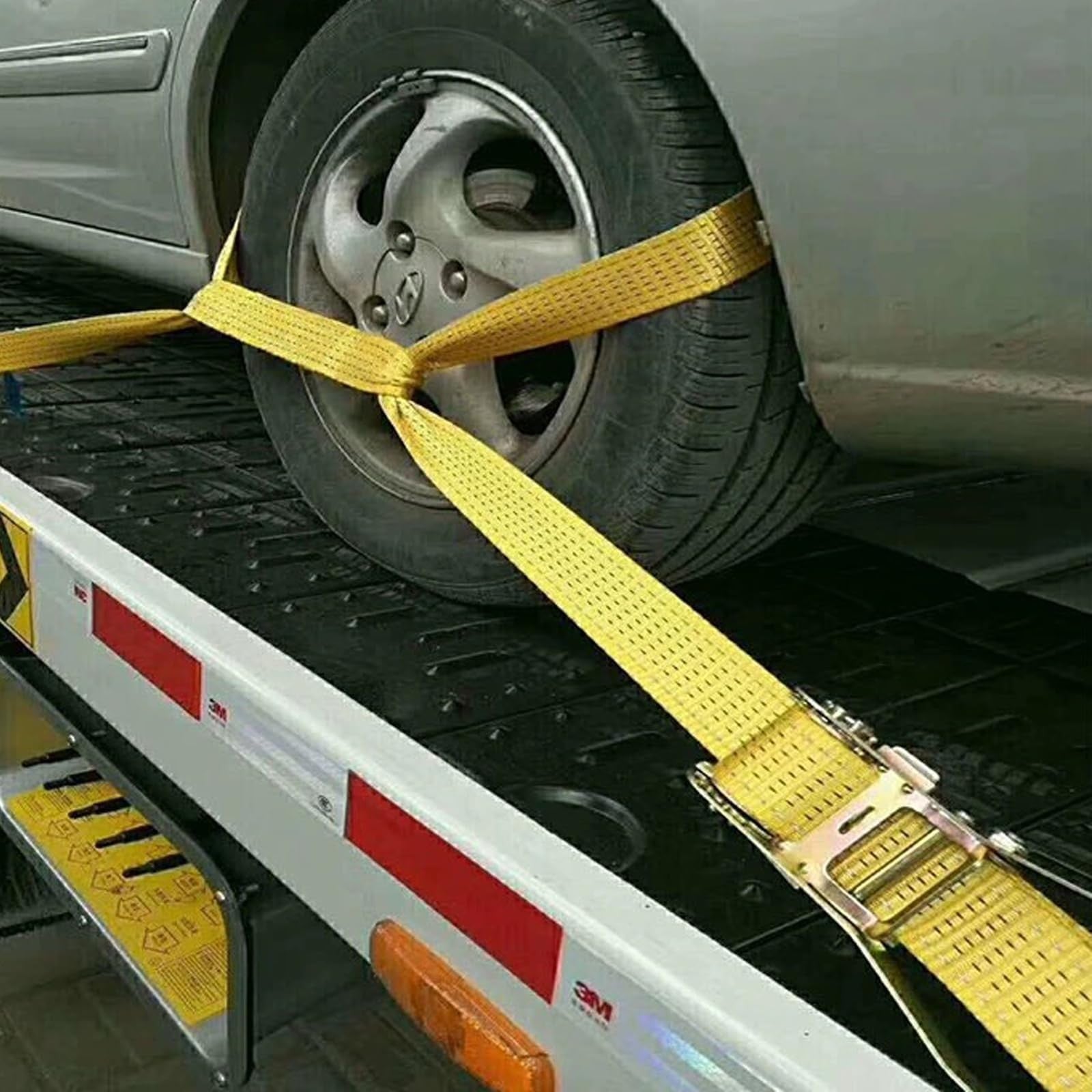Heavy duty MNMAJE ratchet strap with 2-inch width and 8000 lbs break strength, showing the strap and ratchet mechanism.