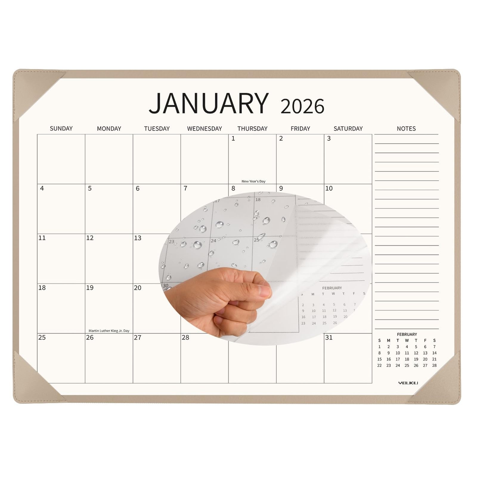 YIBUKIU desk calendar 2026-2027 large 22x17 inch with monthly pages from January 2026 to June 2027, displayed on a desk
