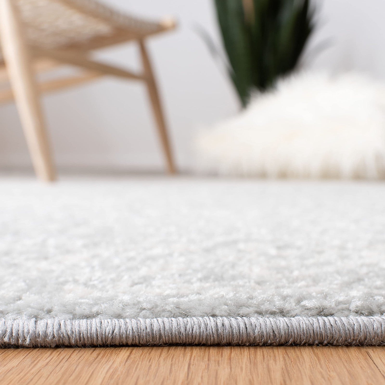 Light grey and ivory Moroccan boho runner rug from the Safavieh Tulum Collection, measuring 2x9 feet, with intricate patterns.