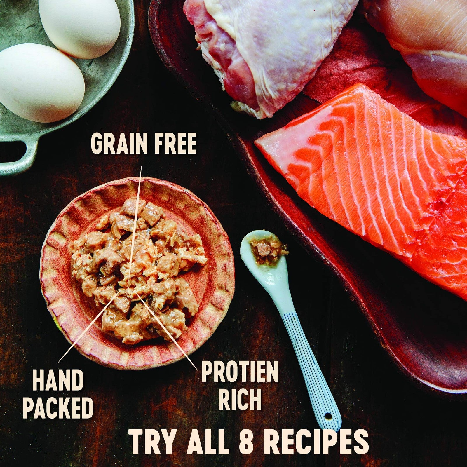 Cans of Wellness CORE Signature Selects Flaked Wet Cat Food with seafood and poultry variety for cats, showing the product packaging.