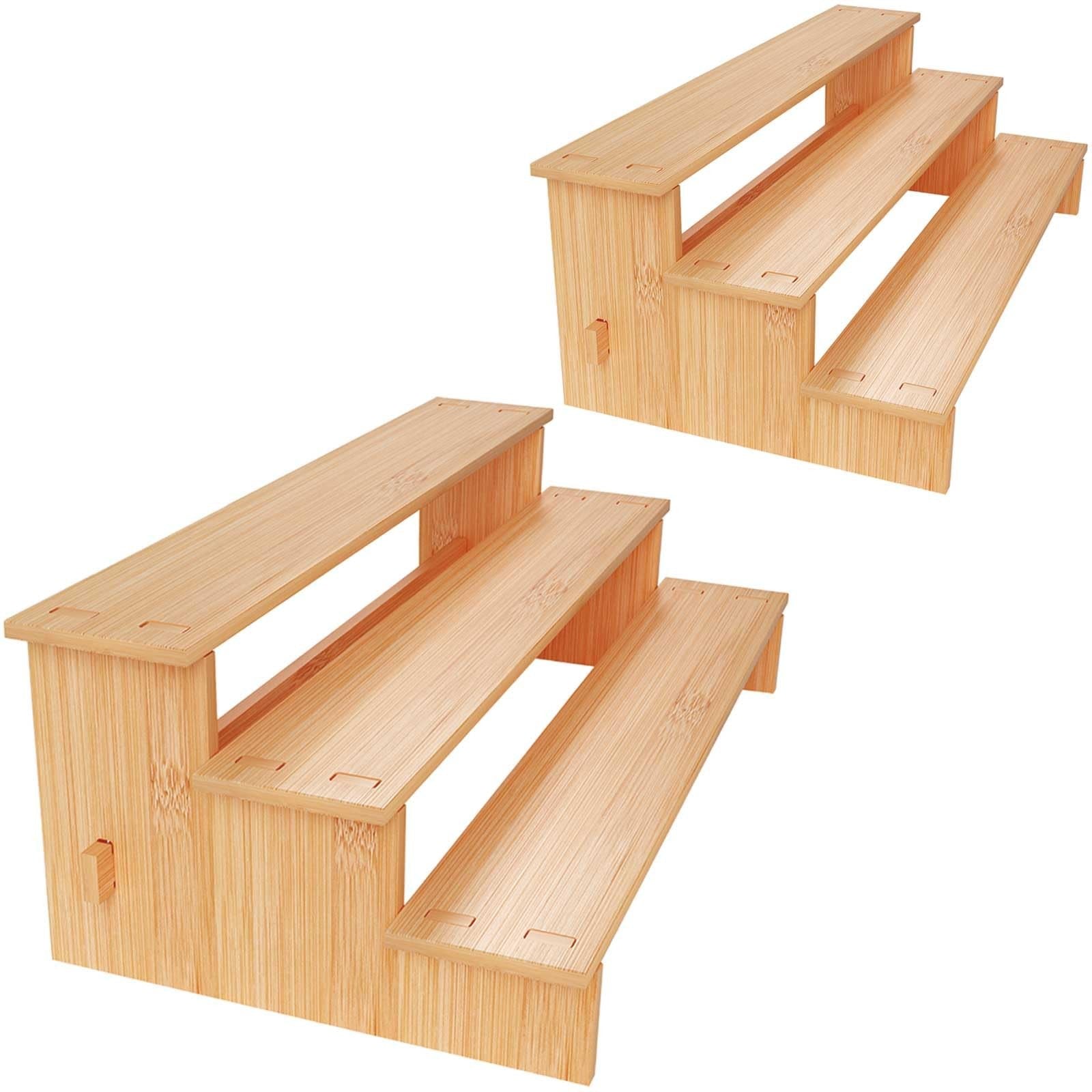 JinDoWin 3-tier spice rack organizer for cabinets, with multiple spice jars arranged on the metal shelves inside a kitchen cabinet.