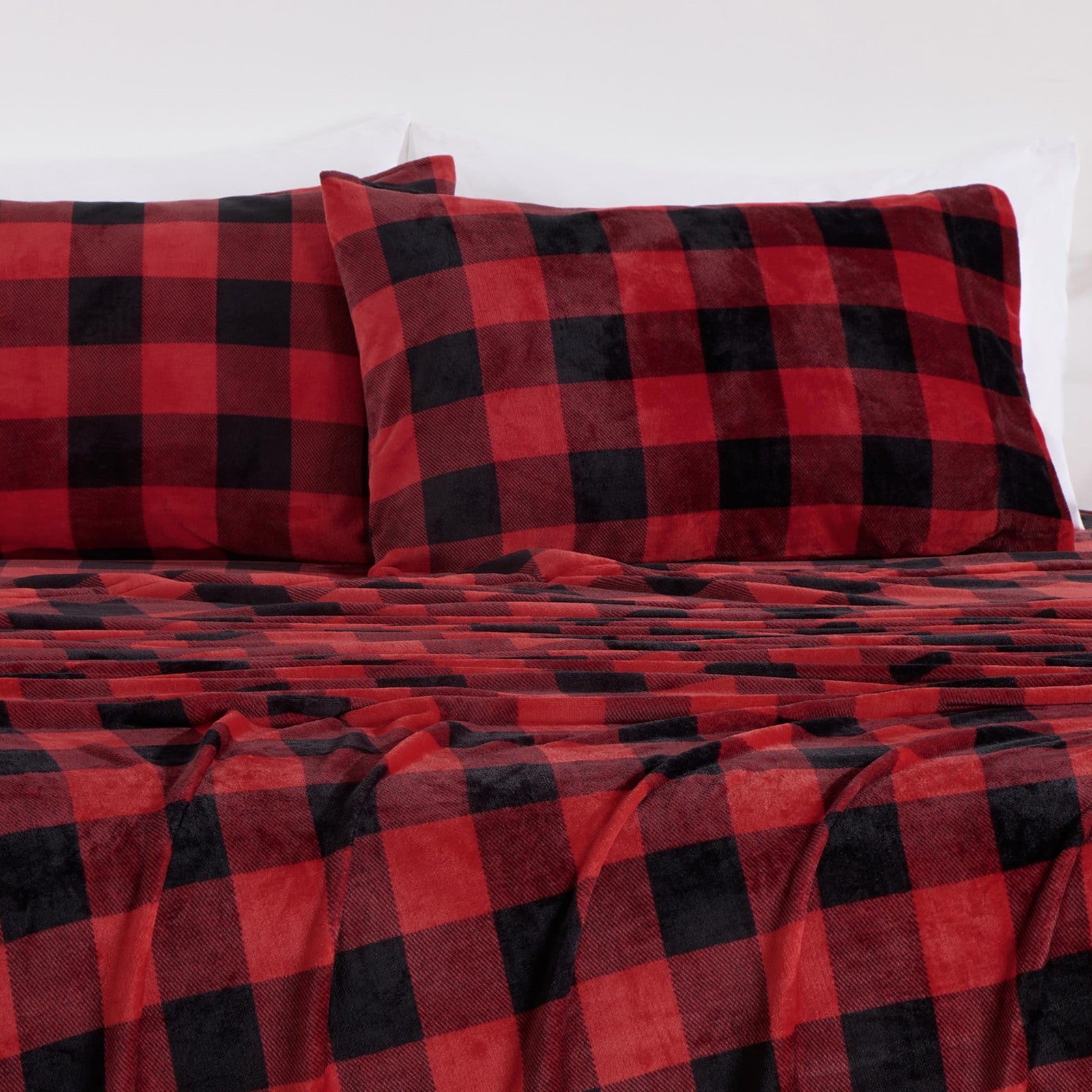 Chezmoi Collection queen microplush fleece sheet set with extra soft, non-pilling velvety texture in light color, shown on bed.