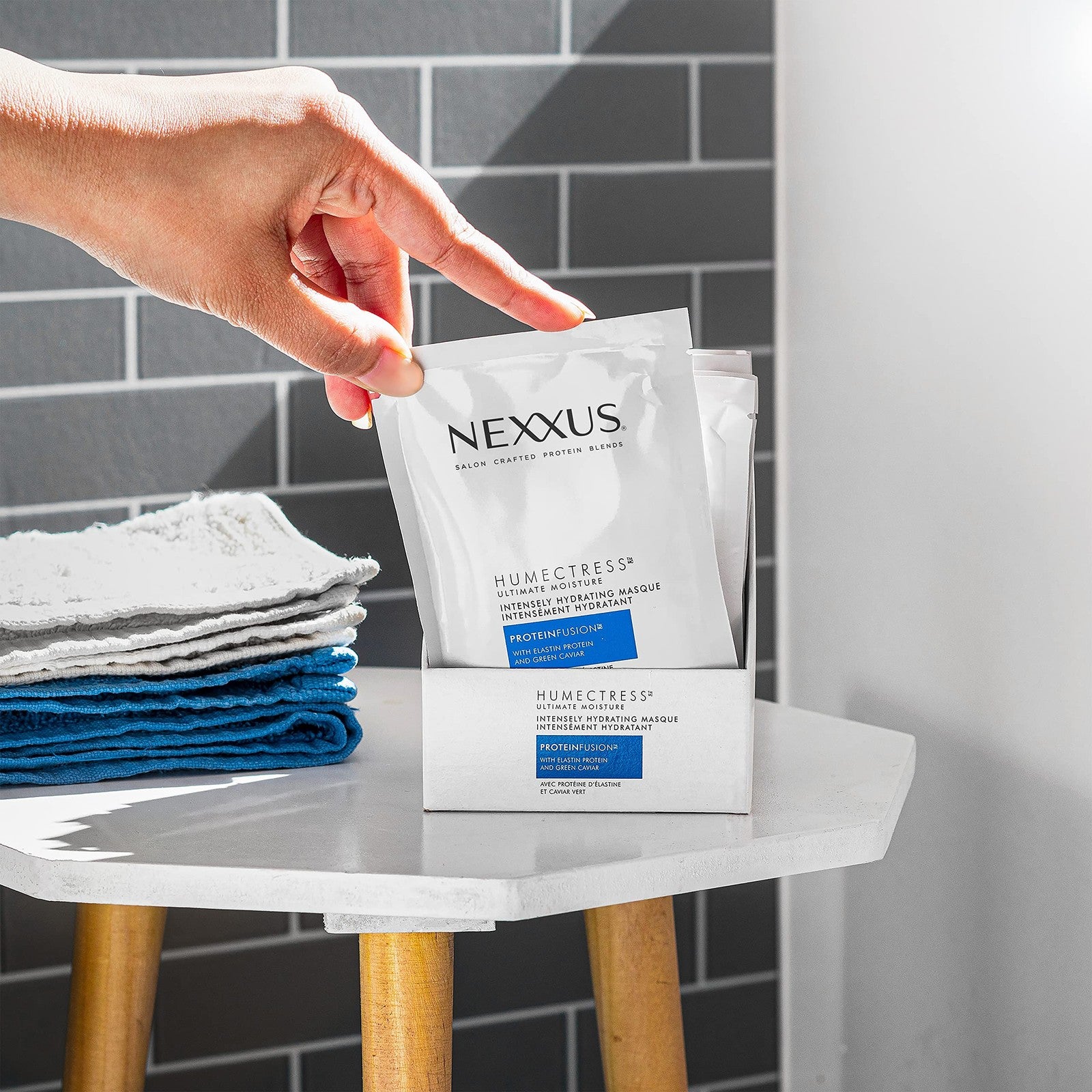 Nexxus Humectress Moisturizing Hair Masque jars showing 10 individual 1.5oz containers for deep conditioning and hydration.