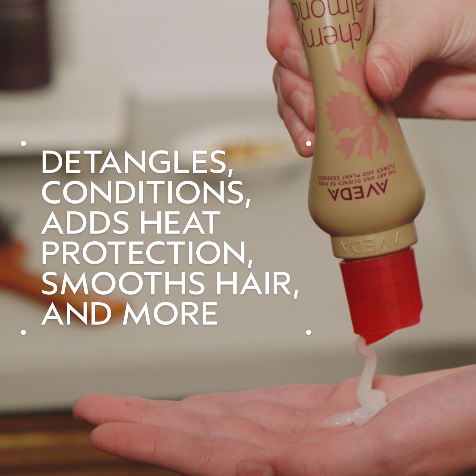 Aveda Cherry Almond Softening Leave-In Conditioner for normal to dry hair, in a white bottle with a flip-top cap.