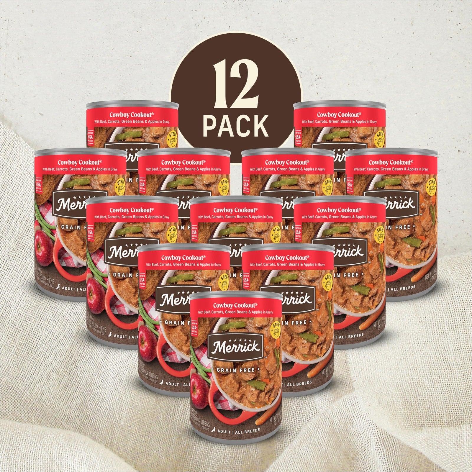 Cans of Merrick Grain Free Wet Dog Food Cowboy Cookout with deboned beef, arranged in a row on a table