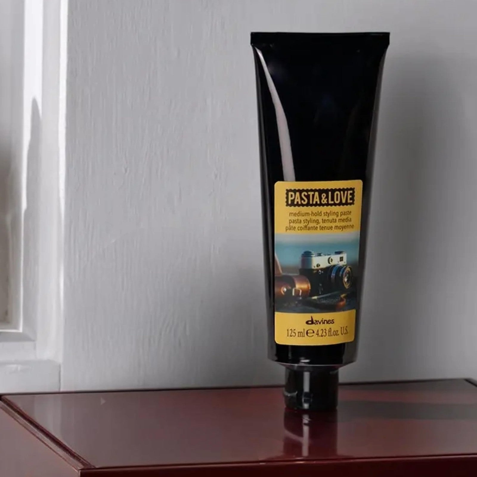 Davines Pasta & Love Medium-Hold Styling Paste in a jar, showing the natural beige hair paste for workable styling and texture.
