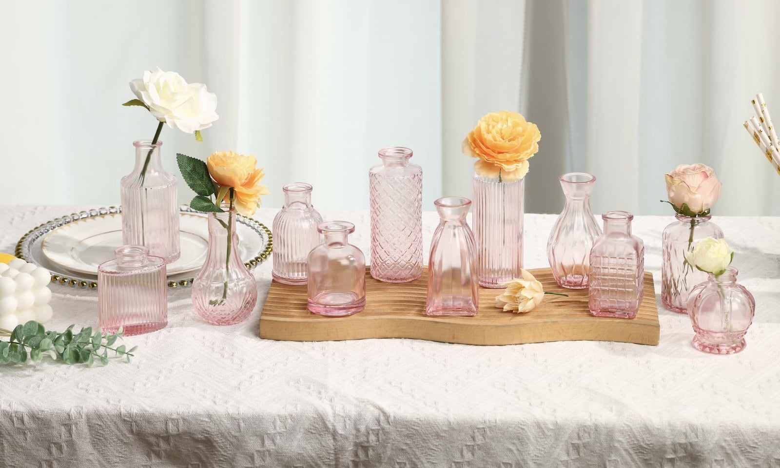 Set of 36 pink glass bud vases by Fixwal, small mini flower vases ideal for centerpieces, arranged in a bulk display.