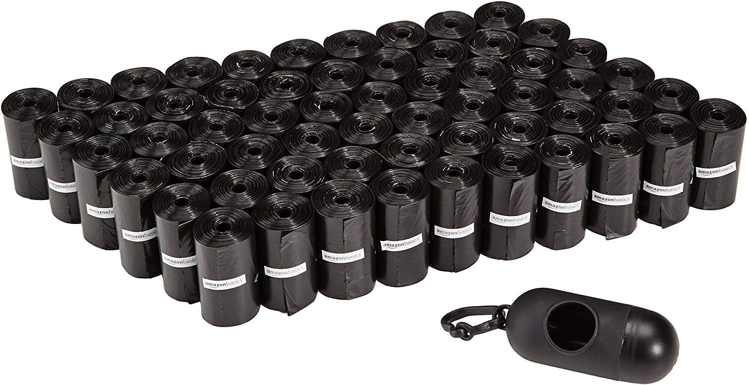 Amazon Basics dog waste bags and training pads in a 100-pack, featuring durable, eco-friendly plastic bags and absorbent training pads.
