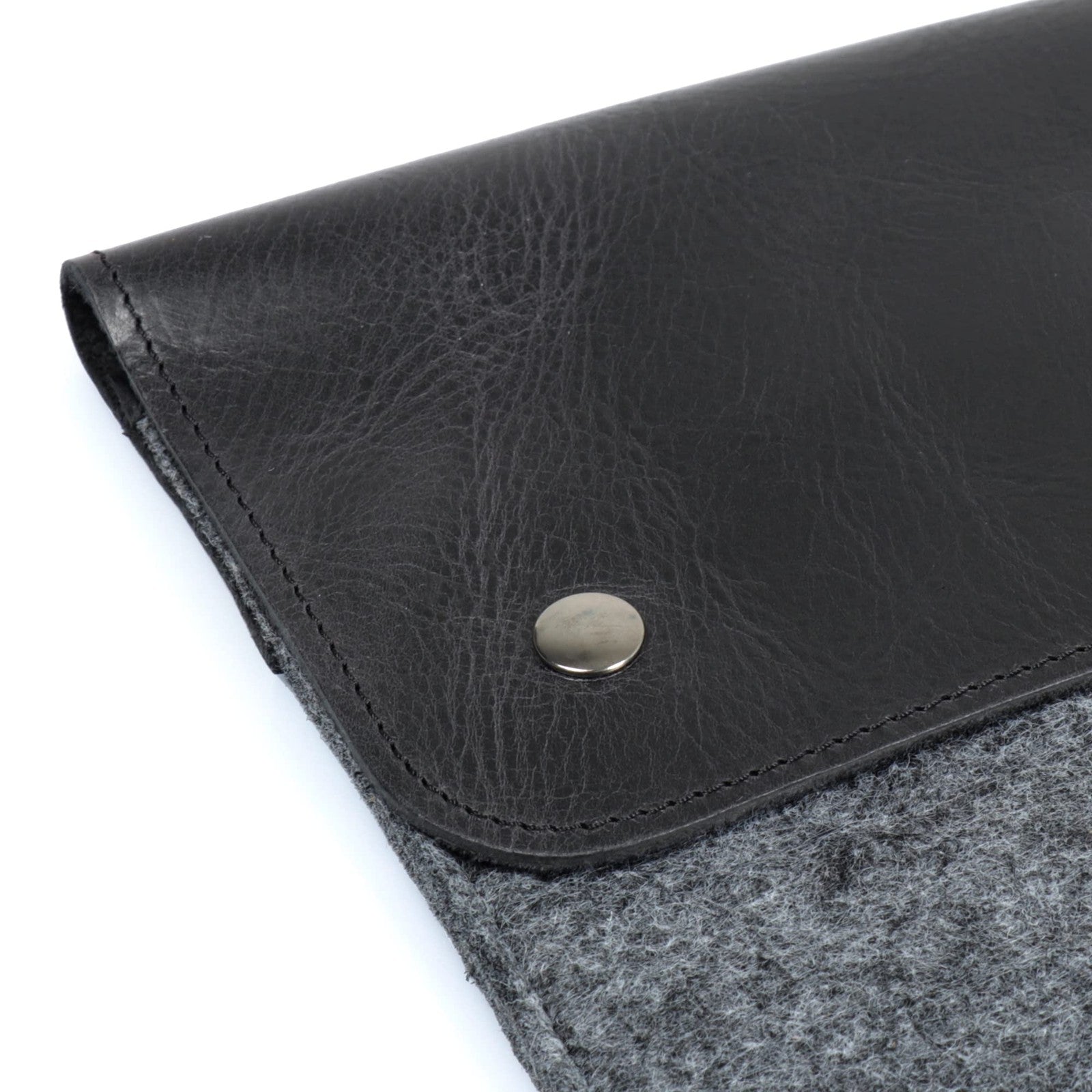 MegaGear genuine leather and fleece MacBook bag sleeve for MacBook Pro, featuring padded interior and sleek design.