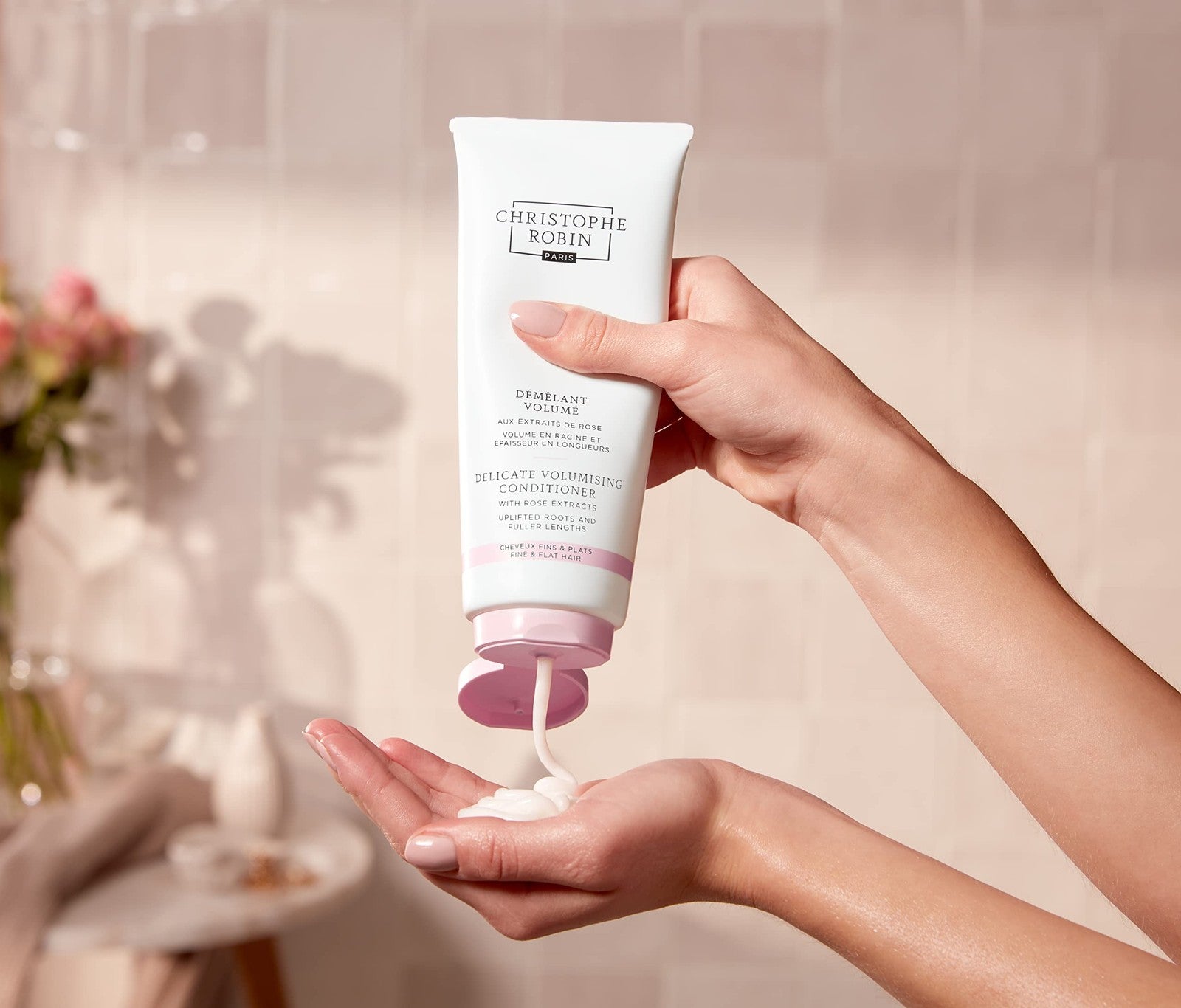 Christophe Robin Delicate Volumizing Conditioner with rose extracts for thin hair, showing bottle with rose details and product label.