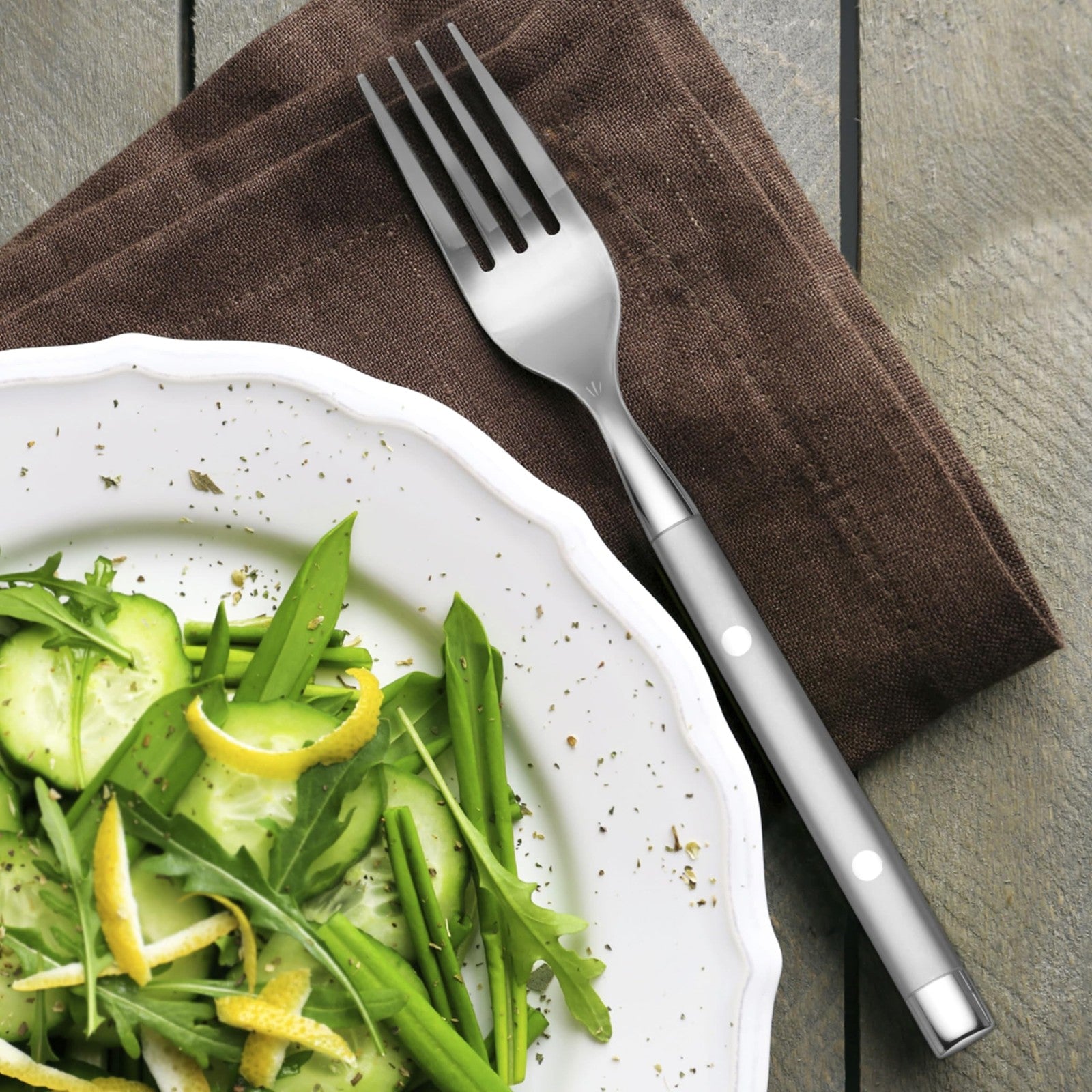 Hampton Forge Hampton Signature Shangrila 20-piece flatware set for four, includes knives, forks, spoons, and serving utensils.