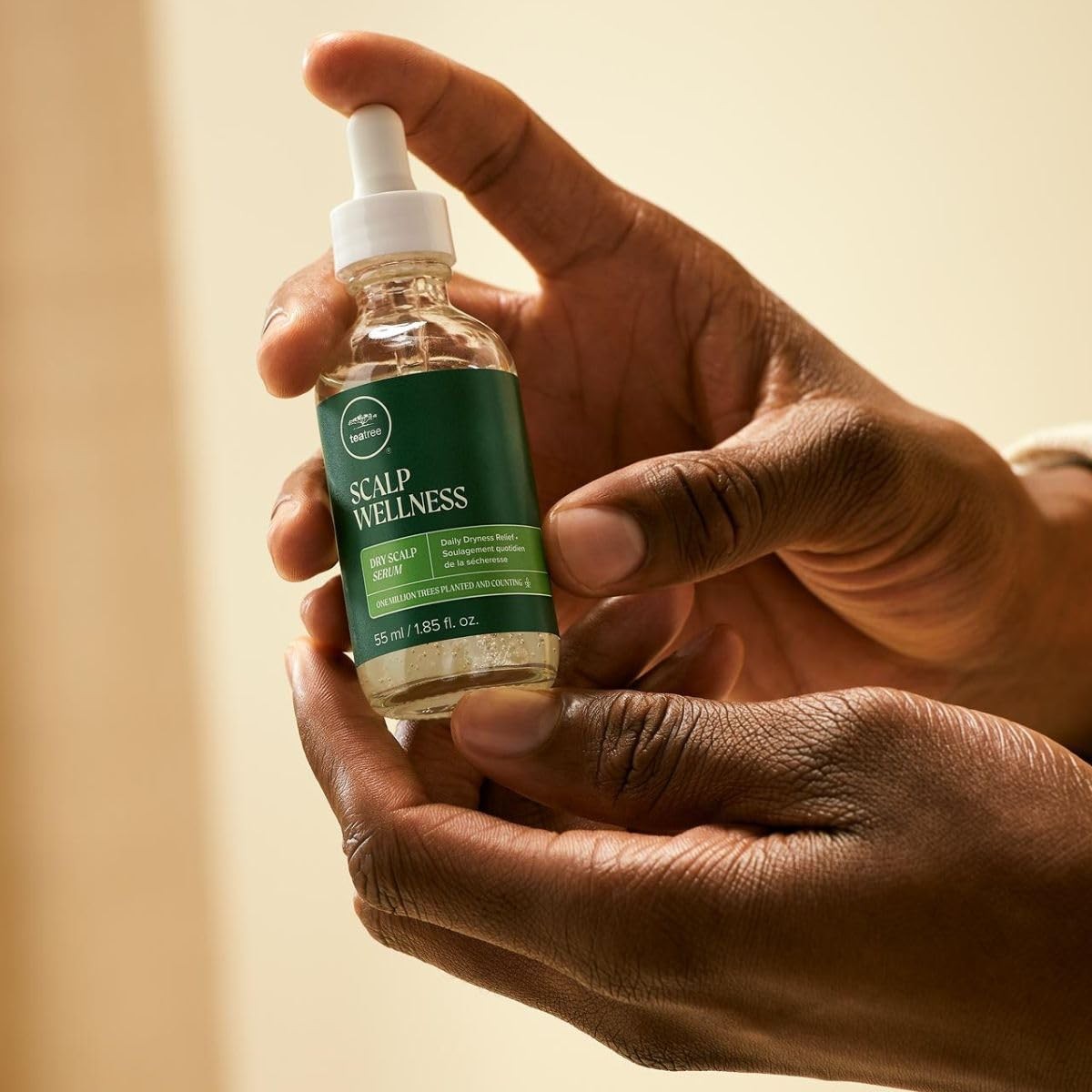 Tea Tree Scalp Wellness Dry Scalp Serum applied to dry hair and scalp for daily dryness relief and scalp hydration.