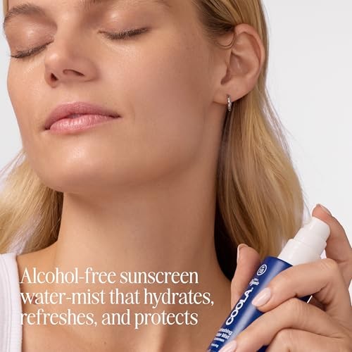 COOLA organic water mist face moisturizer with SPF 18, featuring a spray bottle with a clear liquid and refreshing design.