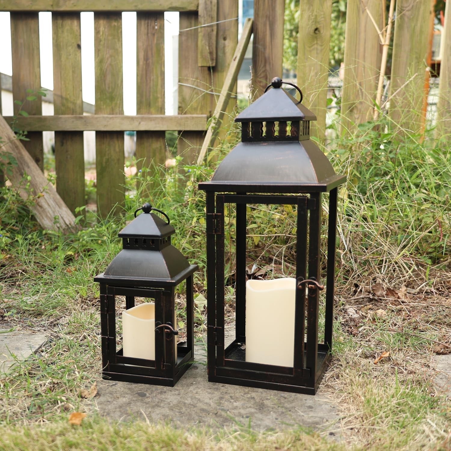 Set of two NEEDOMO LED lanterns with large bronze metal design, decorative outdoor and indoor lighting.