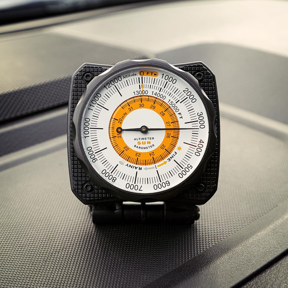Sun Company Altilinq dashboard altimeter and barometer for car with analog display and clear dials, mounted on vehicle dashboard.
