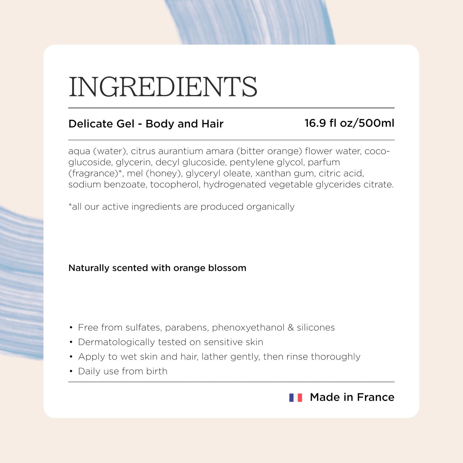 MINOIS PARIS Baby Wash and Shampoo with orange, gentle formula for baby body and hair, shown in a clear bottle with orange accents.